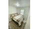 Bedroom featuring natural light, neutral decor, and modern furnishings at 7412 Barberry Ct, Raleigh, NC 27615