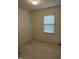 Cozy bedroom features fresh paint and a window letting in natural light at 7412 Barberry Ct, Raleigh, NC 27615