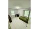 Well-lit bedroom features a desk, chair, and daybed with ample natural light at 7412 Barberry Ct, Raleigh, NC 27615