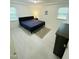 Bedroom features white vinyl floors, neutral decor, and natural light from two windows at 7412 Barberry Ct, Raleigh, NC 27615