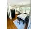 Bright eat-in kitchen features white cabinets, stainless steel appliances, and hardwood floors at 7412 Barberry Ct, Raleigh, NC 27615