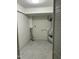 Clean laundry room with gray tile floors, utility connections, and white walls at 7412 Barberry Ct, Raleigh, NC 27615