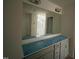 Bathroom vanity featuring a large mirror, ample counter space, and classic cabinets at 788 Old Station Pointe, Angier, NC 27501