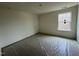 Bright, unfinished bedroom with a window and ample natural light at 788 Old Station Pointe, Angier, NC 27501