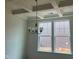 Dining room showcasing a modern light fixture and window views at 788 Old Station Pointe, Angier, NC 27501