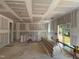 Unfinished kitchen and eating area featuring natural light from a sliding door during the construction phase at 788 Old Station Pointe, Angier, NC 27501