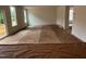 An incomplete living room featuring two large windows and a view through to another room at 788 Old Station Pointe, Angier, NC 27501
