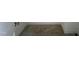 A carpeted staircase with a neutral color palette, providing a safe and comfortable transition between floors at 788 Old Station Pointe, Angier, NC 27501