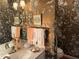 Detailed bathroom with floral wallpaper and an ornate faucet at 8 Greenside Ct, Durham, NC 27707