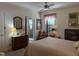 Light-filled bedroom with neutral decor, ceiling fan, and access to ensuite bathroom at 8 Greenside Ct, Durham, NC 27707
