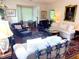 Inviting living room with hardwood floors, comfortable seating, and ample natural light at 8 Greenside Ct, Durham, NC 27707