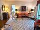 Bright living room featuring a patterned rug, comfortable seating, and ample natural light at 8 Greenside Ct, Durham, NC 27707