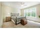 Bedroom featuring a king bed, side tables, lamps, and window at 83 Vandalia Ave, Chapel Hill, NC 27516
