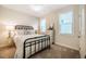 Comfortable bedroom with carpet, ceiling fan, and two windows with views at 83 Vandalia Ave, Chapel Hill, NC 27516