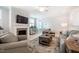 Cozy living room with a fireplace, TV, and stylish furnishings at 83 Vandalia Ave, Chapel Hill, NC 27516