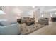 Spacious living room with hardwood floors, comfortable seating, and bright lighting fixtures at 83 Vandalia Ave, Chapel Hill, NC 27516
