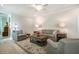 Comfortable living room features neutral color palette, area rug, and recessed lighting at 83 Vandalia Ave, Chapel Hill, NC 27516