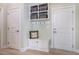 Mudroom with a bench, storage, and access to the garage at 83 Vandalia Ave, Chapel Hill, NC 27516