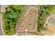 Aerial view of the community dog park showing amenities, layout and the surrounding green space and walking paths at 906 Kensley Grove Ln # 68, Fuquay Varina, NC 27526