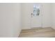 Bright entryway featuring wood-look flooring and a door with glass, offering a glimpse of the exterior at 908 Kensley Grove Ln # 68, Fuquay Varina, NC 27526