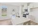 Modern kitchen showcasing white cabinets, quartz countertops, stainless steel appliances, and natural light at 908 Kensley Grove Ln # 68, Fuquay Varina, NC 27526