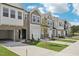 Charming townhomes featuring modern architecture, landscaping, and attached garages at 908 Kensley Grove Ln # 68, Fuquay Varina, NC 27526