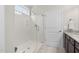 Modern bathroom with a glass-enclosed shower and tiled floors at 10 Currituck Ln, Durham, NC 27703