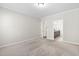 A bright bedroom with carpeted floors and an ensuite bathroom at 10 Currituck Ln, Durham, NC 27703