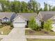 Charming single-story home with a manicured front yard, two-car garage, and lovely landscaping at 10 Currituck Ln, Durham, NC 27703