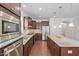 Spacious kitchen with stainless steel appliances, granite countertops, and a central island at 10 Currituck Ln, Durham, NC 27703