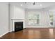 Bright living room with hardwood floors, fireplace, and lots of natural light at 10 Currituck Ln, Durham, NC 27703