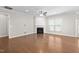 Bright living room with hardwood floors, a fireplace, and abundant natural light at 10 Currituck Ln, Durham, NC 27703