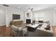 Bright living room with a fireplace, hardwood floors, and modern furniture at 10 Currituck Ln, Durham, NC 27703
