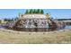 The Carolina Arbors entrance with a scenic waterfall and beautifully landscaped surroundings at 10 Currituck Ln, Durham, NC 27703