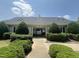 Welcoming pool entrance with manicured landscaping and clear signage for community residents at 1002 Dogwood Bloom Ln, Knightdale, NC 27545