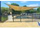 A fenced-in pool and playground area offers shaded playground and a pool at 1002 Dogwood Bloom Ln, Knightdale, NC 27545
