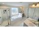 Luxurious bathroom with a soaking tub, glass enclosed shower, and double vanity at 1002 Dogwood Bloom Ln, Knightdale, NC 27545