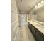 Modern bathroom boasts dual sinks, a large mirror, and a tub/shower combination at 1002 Dogwood Bloom Ln, Knightdale, NC 27545