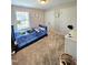 Comfortable bedroom with carpet, a ceiling fan, and a window offering views of the outdoors at 1002 Dogwood Bloom Ln, Knightdale, NC 27545