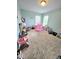 Spacious ' room with blue walls, two windows, and ample space for play and creativity at 1002 Dogwood Bloom Ln, Knightdale, NC 27545