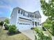 Two-story home with attached garage and welcoming porch, complemented by well-maintained landscaping at 1002 Dogwood Bloom Ln, Knightdale, NC 27545