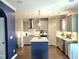 Spacious kitchen with an island, stainless steel appliances, and white subway tile backsplash at 1002 Dogwood Bloom Ln, Knightdale, NC 27545