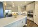 Gourmet kitchen boasts stainless steel appliances, a large center island, and pendant lighting at 1002 Dogwood Bloom Ln, Knightdale, NC 27545