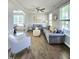 Bright and inviting living room featuring hardwood floors, neutral tones, and abundant natural light at 1002 Dogwood Bloom Ln, Knightdale, NC 27545
