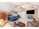 Spacious bedroom with large bed, TV, and multiple seating areas with natural light at 1003 Fairfax Woods Dr, Apex, NC 27502
