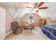 Spacious bedroom featuring a large bed, sitting area with multiple chairs, and natural light at 1003 Fairfax Woods Dr, Apex, NC 27502