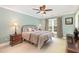 Comfortable bedroom with a ceiling fan and natural light at 1003 Fairfax Woods Dr, Apex, NC 27502