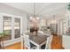 Bright dining area with a view connecting to kitchen and living areas at 1003 Fairfax Woods Dr, Apex, NC 27502