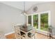 Cozy dining area with large window, natural light, and view to the backyard at 1003 Fairfax Woods Dr, Apex, NC 27502