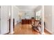 Bright home office featuring hardwood floors, classic wood desk, and rocking chair at 1003 Fairfax Woods Dr, Apex, NC 27502